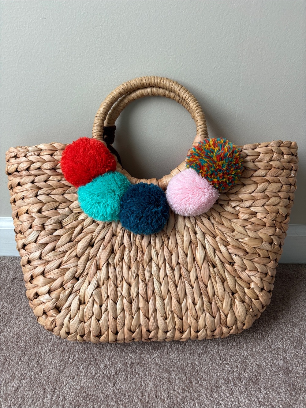 Straw Tote with Multicolor Pom-Pom Accents and pull string closure. - Picture 2 of 4